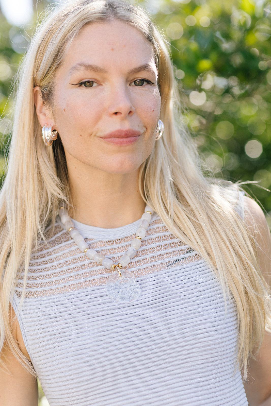 Claudia Necklace on model with blue dress