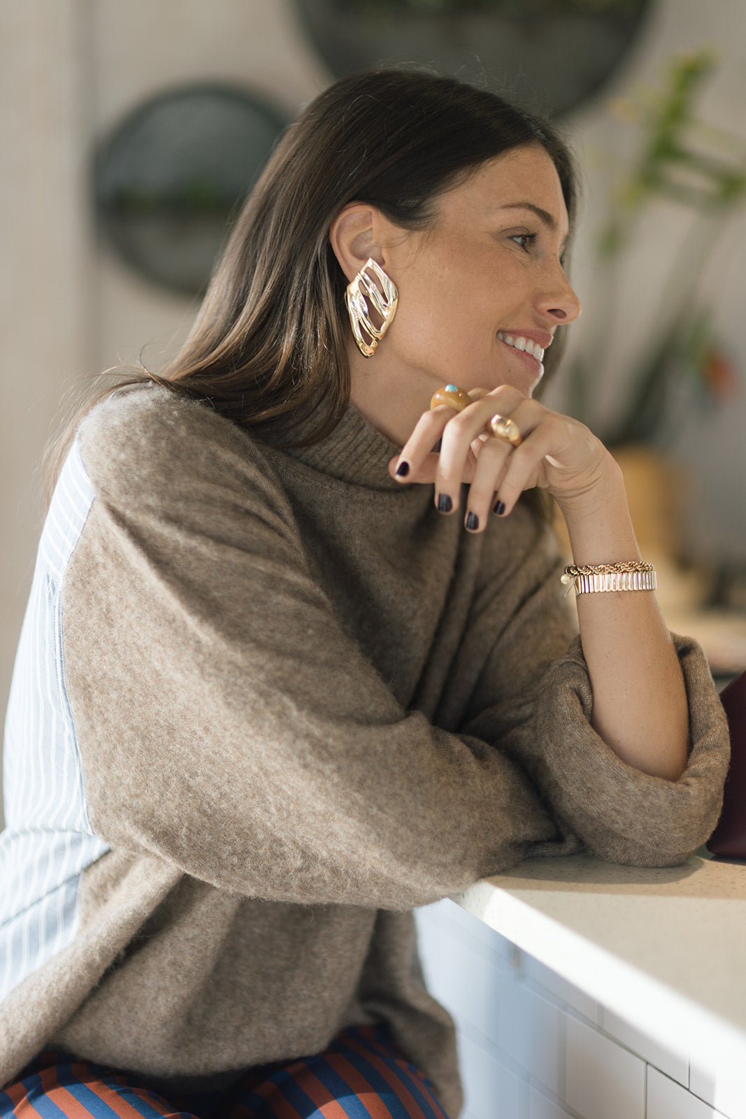 The Sheeny Ring and Cierra Cuff Bracelet on model with other jewelry