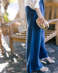 Tali Pants side with Inez Clutch