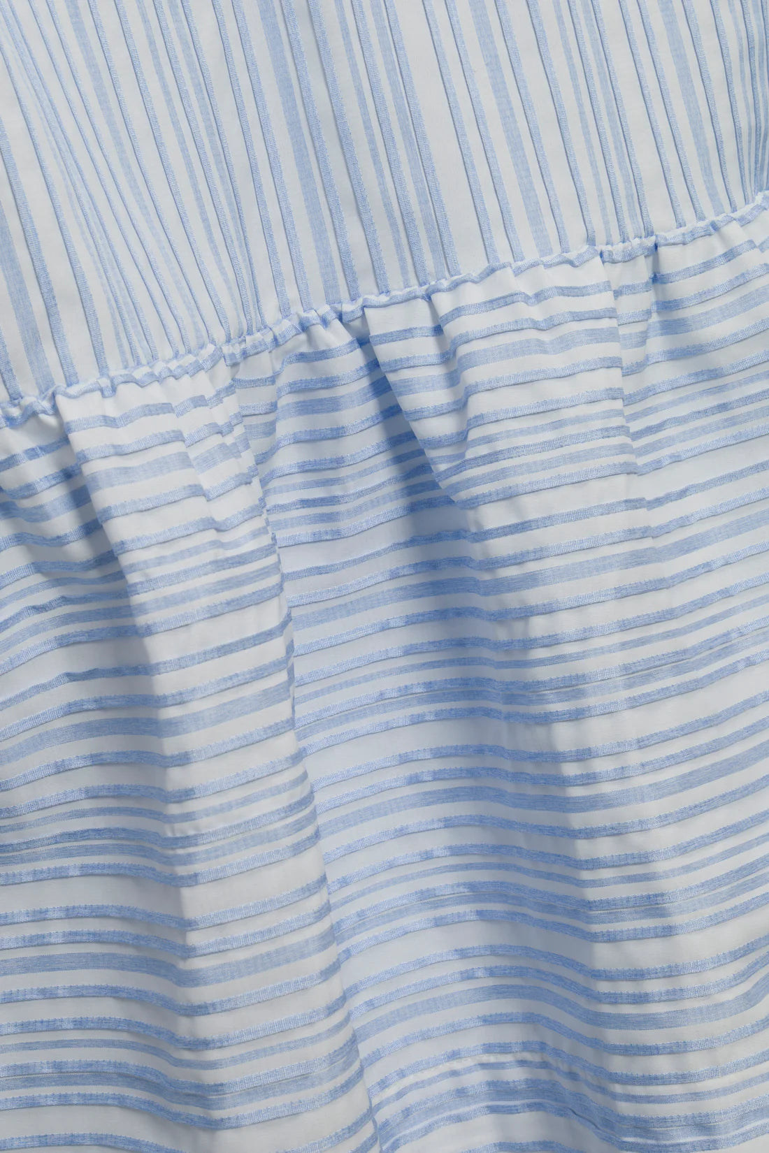 Close-up of a blue and white striped fabric texture