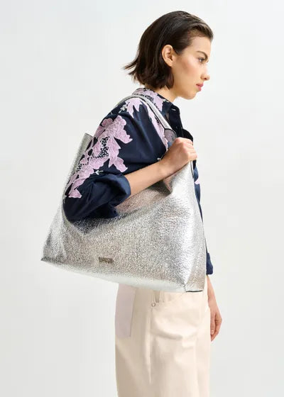 Istrala Silver Shopper Bag on model's shoulder
