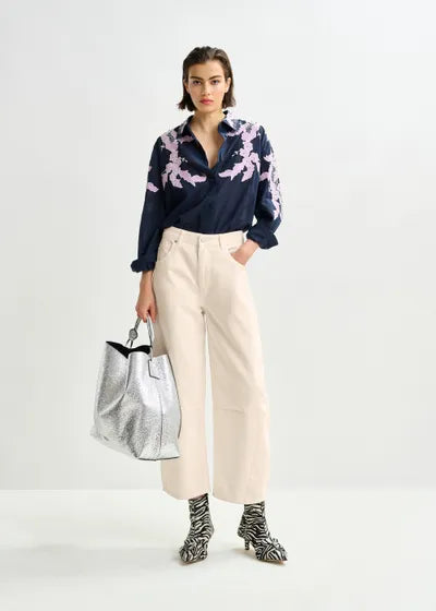 Istrala Silver Shopper Bag held at model's side