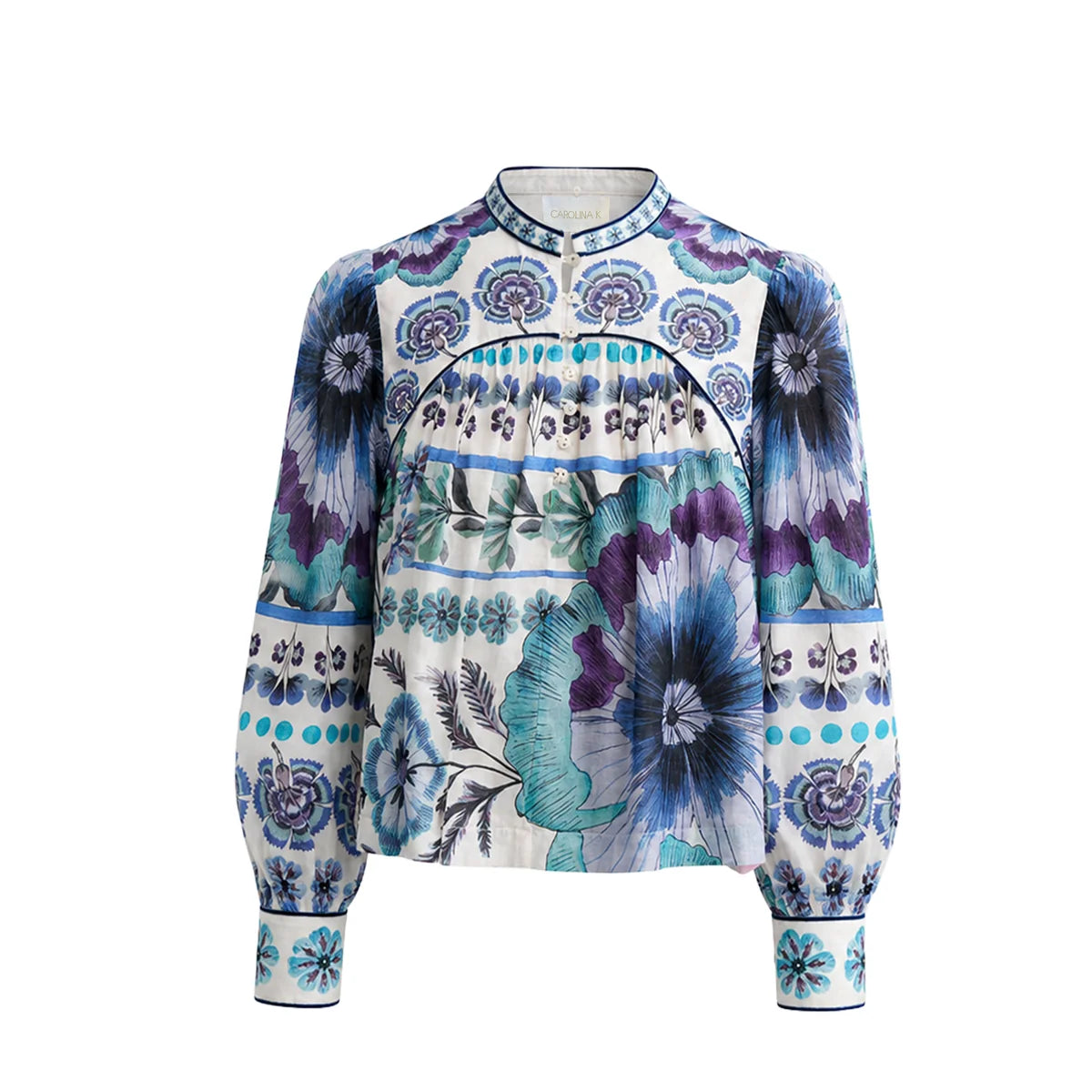A long-sleeve blouse with a mandarin collar and a vibrant blue, purple, and teal floral pattern on a white base, shown against a plain white background.