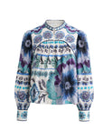 A long-sleeve blouse with a mandarin collar and a vibrant blue, purple, and teal floral pattern on a white base, shown against a plain white background.