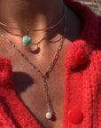 Lea Pearl Lariat Necklace front view on model paired with a heart choker necklace