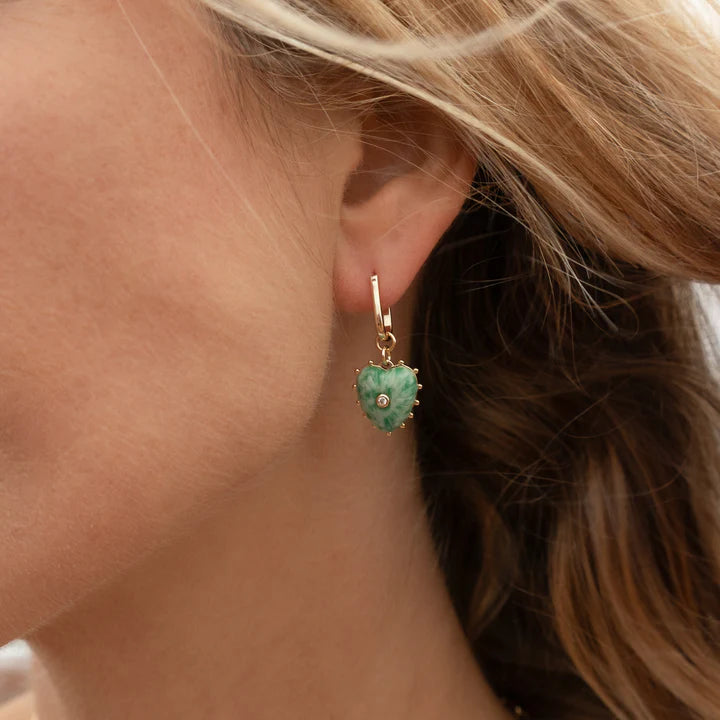 Isabel Green Dot Heart Earrings on ear