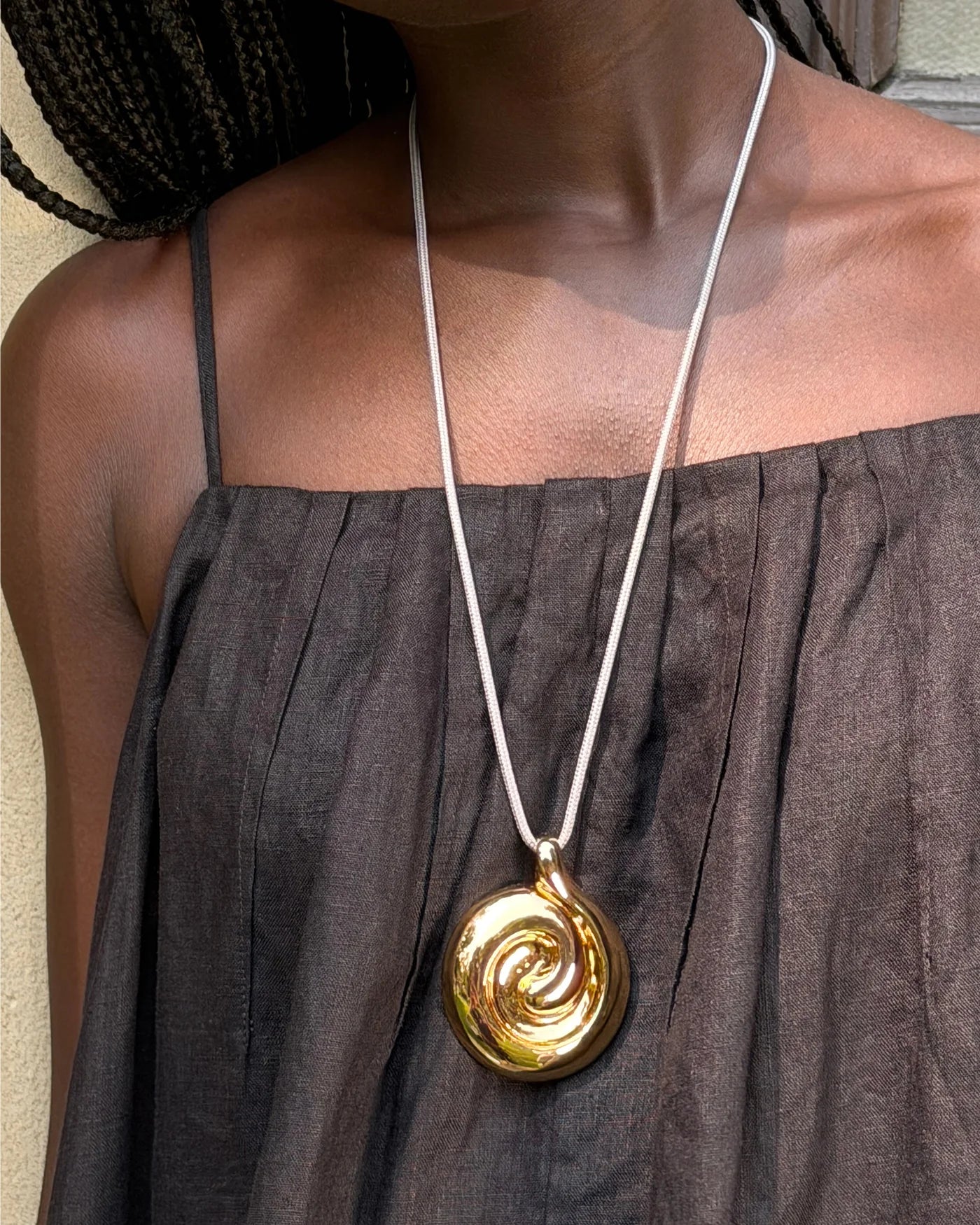 nico pendant necklace on a model with a black shirt 