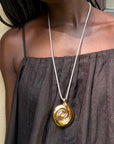 nico pendant necklace on a model with a black shirt 