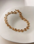 nico collar necklace on a cream background