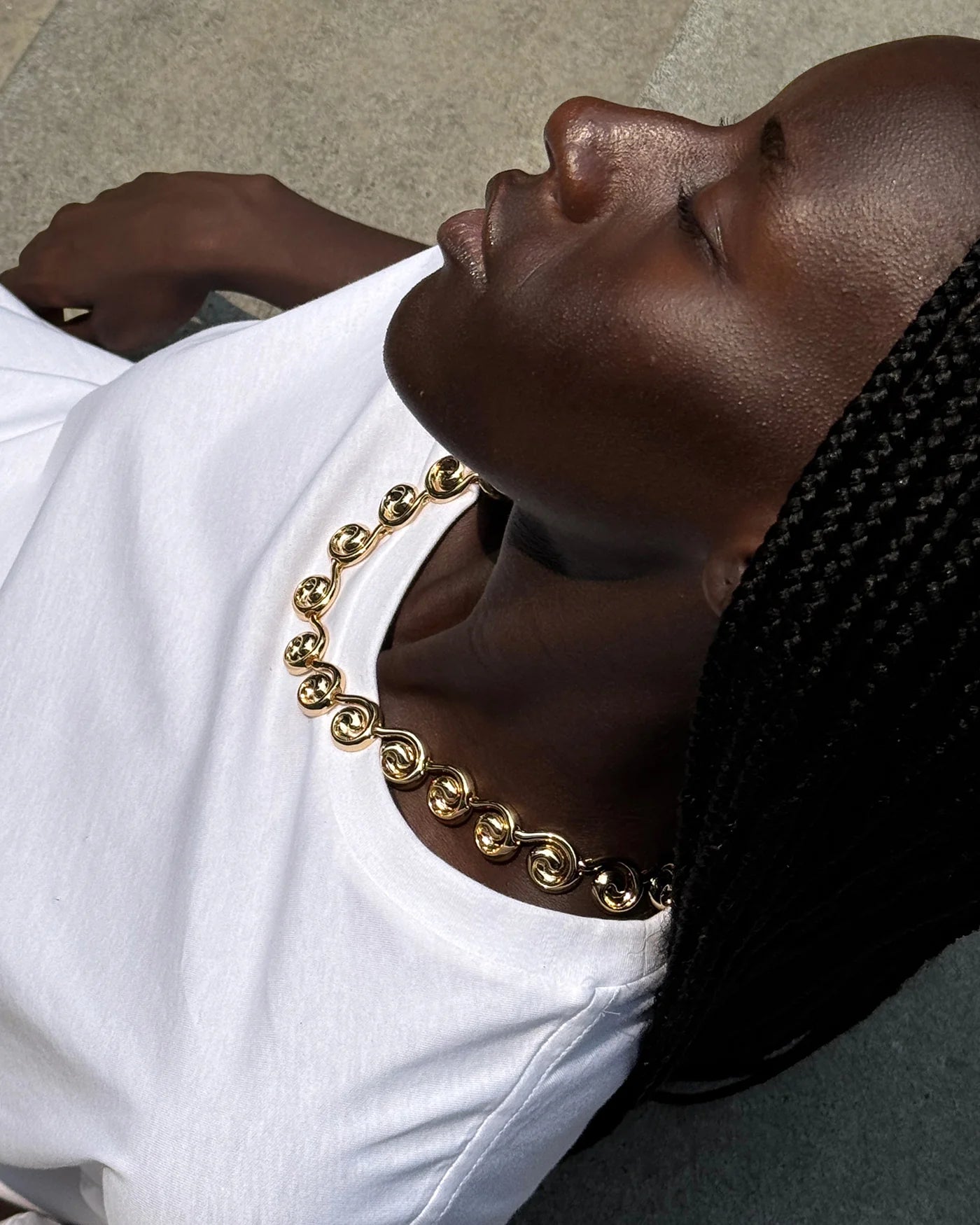 nico collar neckalce on a model with a white tee
