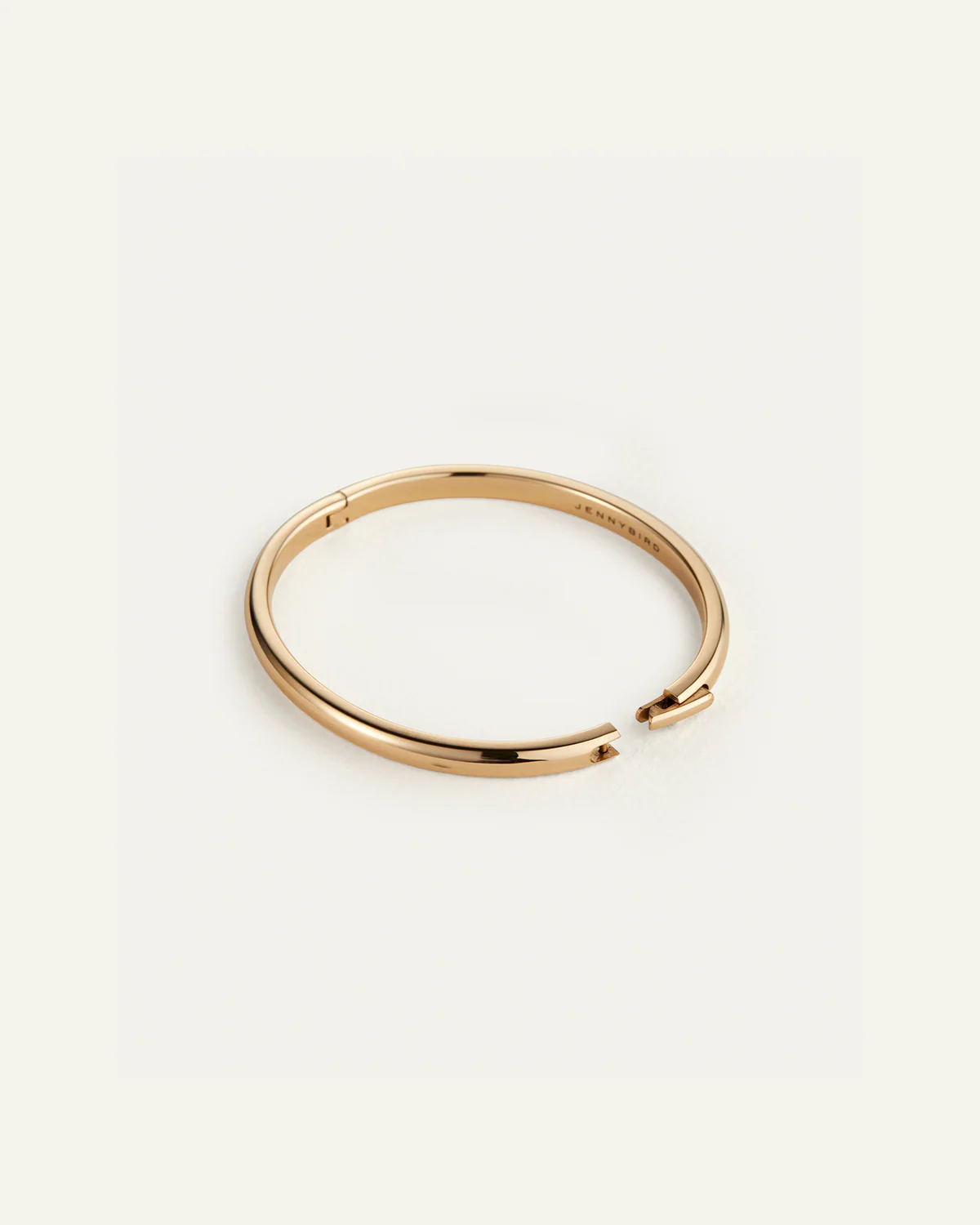 Gold bracelet on a white background