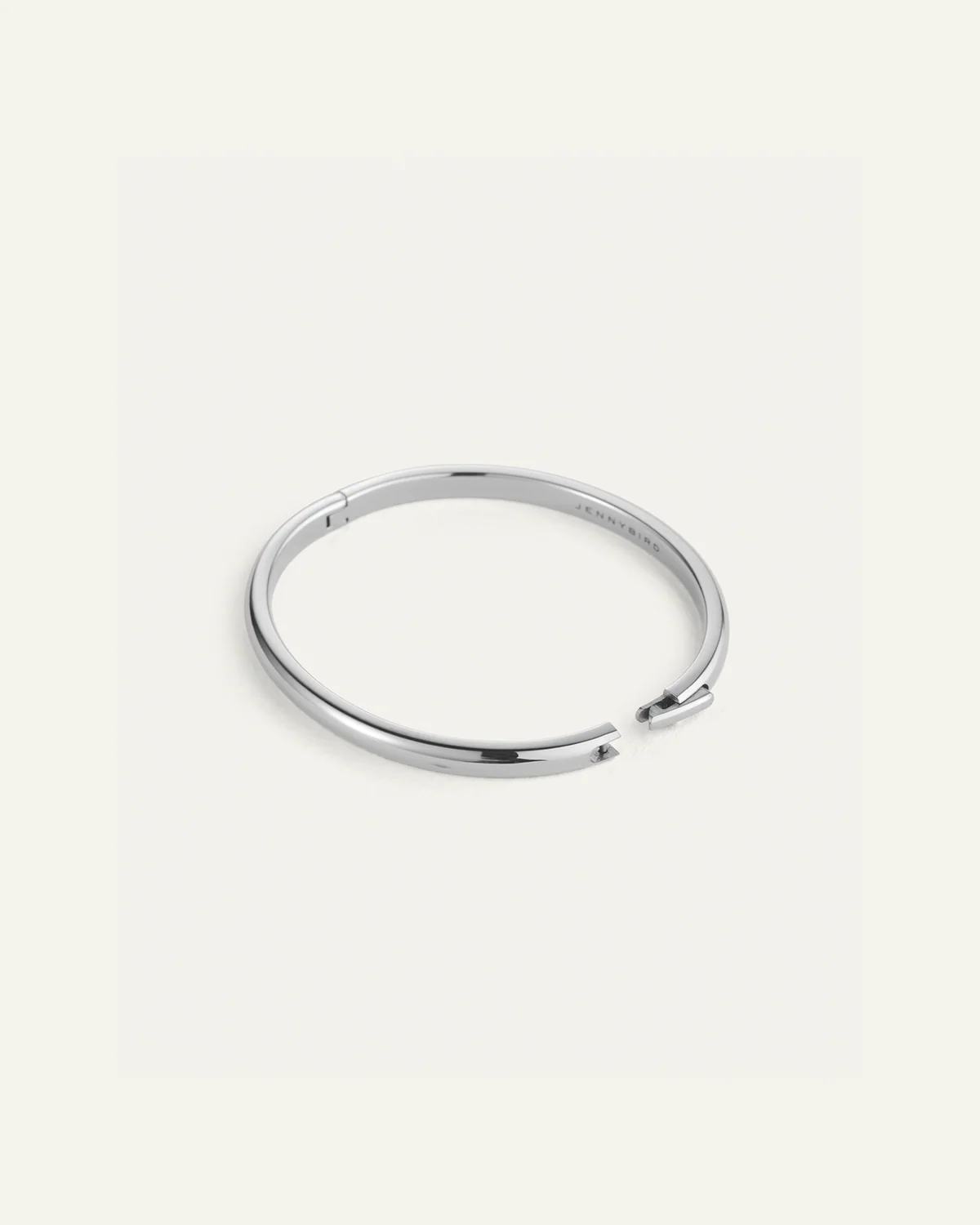 Silver bangle on a white background