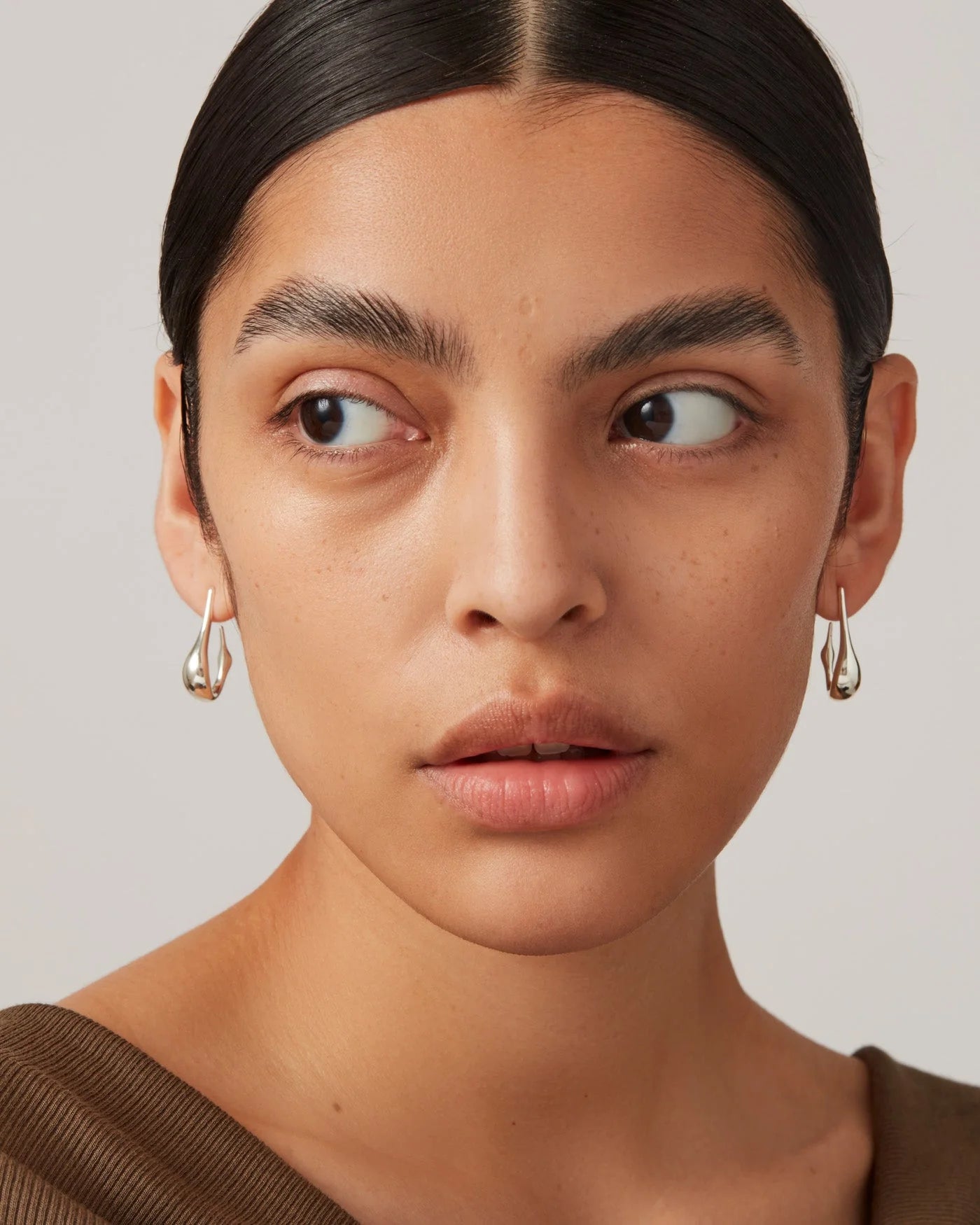 Colette Hoops Small in Silver front view on model