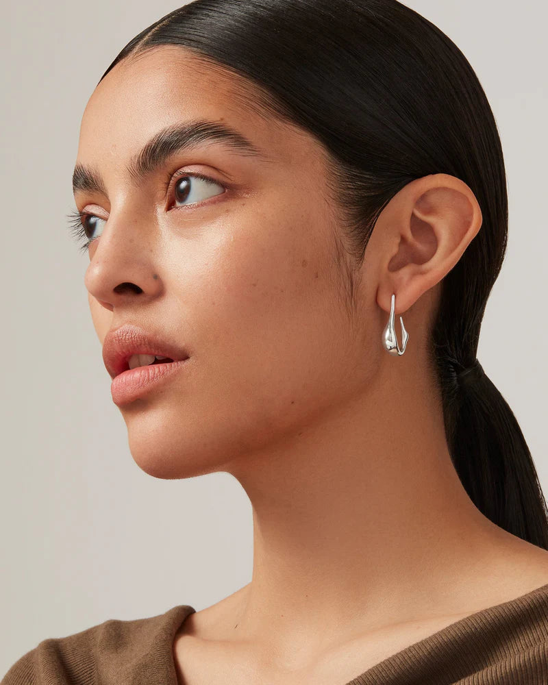 Colette Hoops Small in Silver farther back side view on model