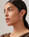 Colette Hoops Small in Silver farther back side view on model