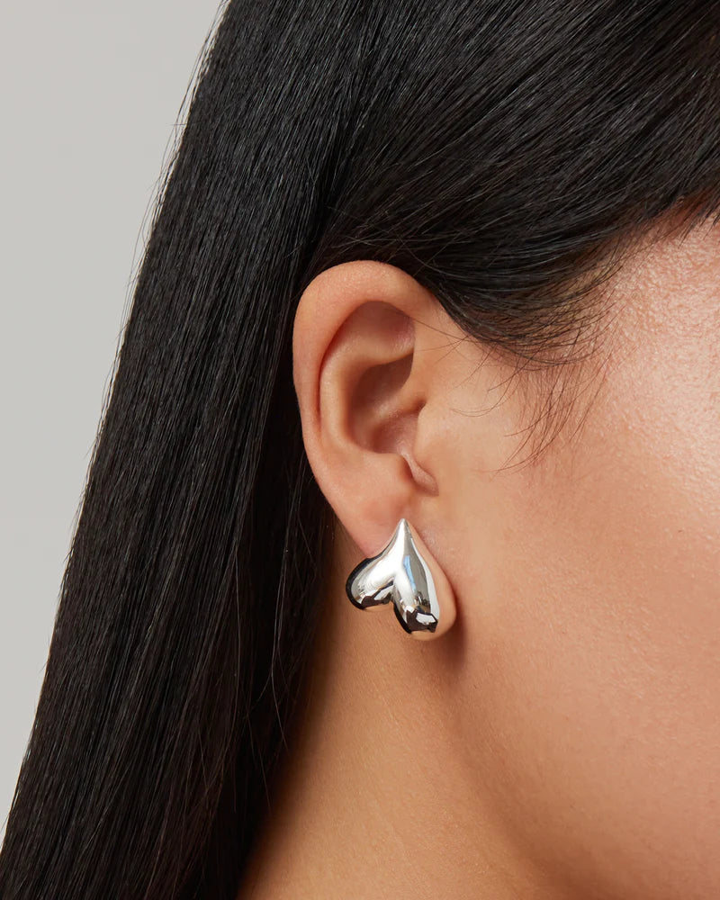 Art Heart Button Earrings on model, upside down