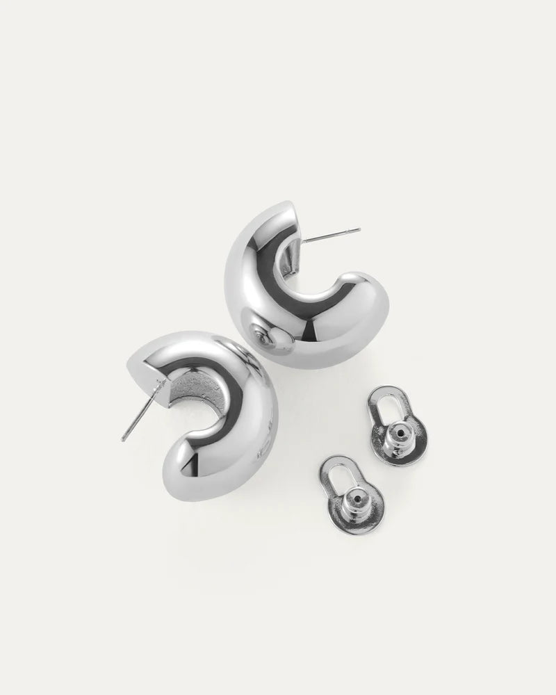 Gemma Hoops in Silver with backings taken off on white background