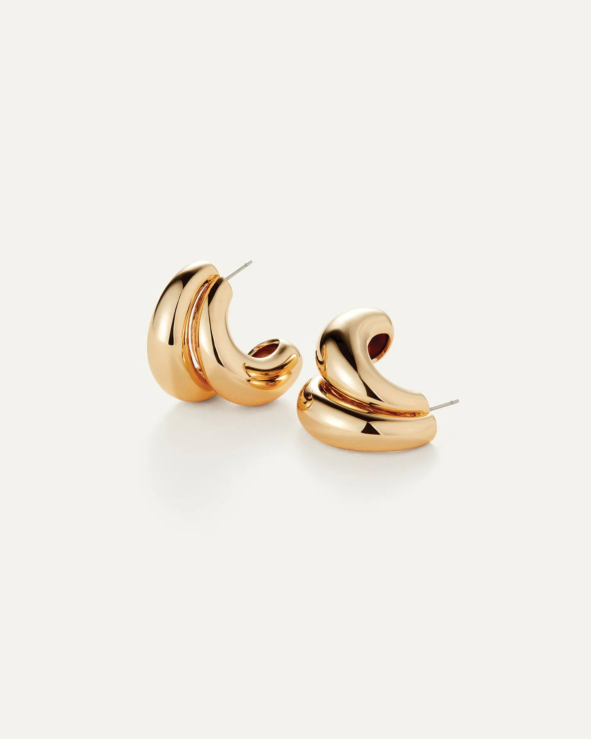 Gold hoop earrings on a white background