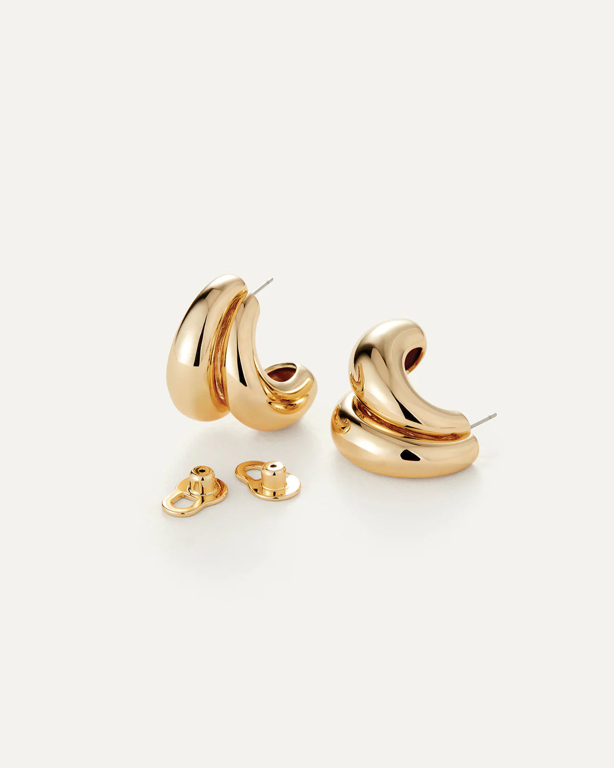 Gold hoop earrings on a white background