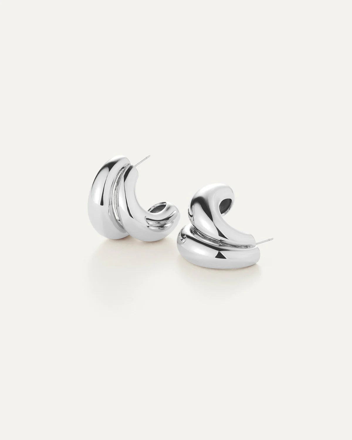 Pair of silver hoop earrings on a white background