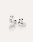Pair of silver hoop earrings on a white background