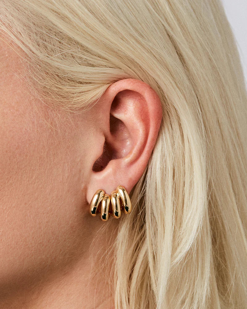 Two Mini Florence Earrings in Gold next to each other on model's ear