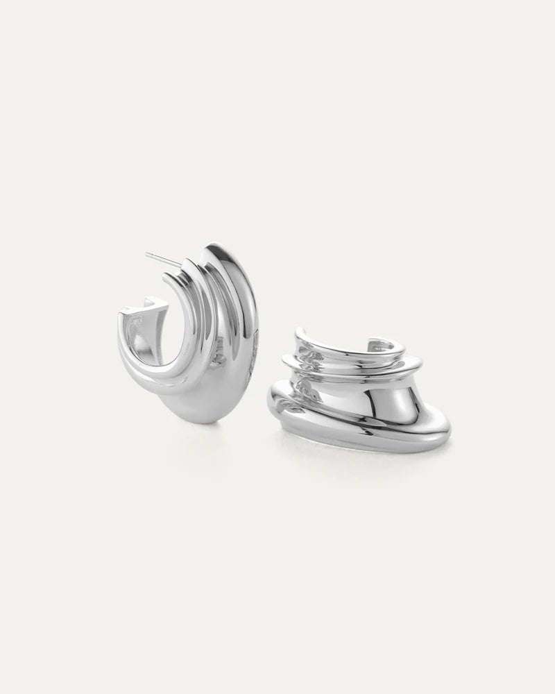 Pair of silver hoop earrings on a white background