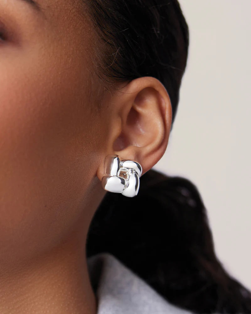 Small Woven Square Earrings in Silver extreme close up front view on model