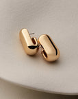  gold earrings on a white background
