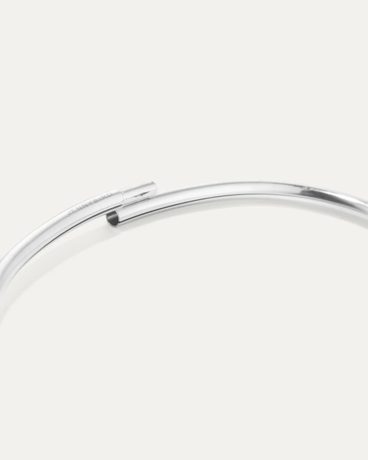 Silver bracelet on a light gray background