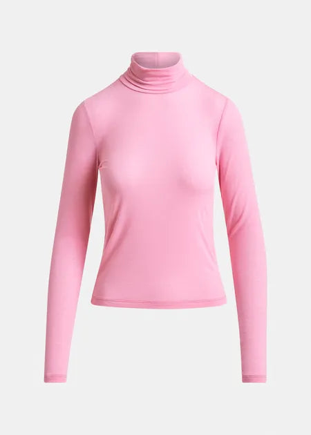Pink turtleneck sweater on a light gray background
