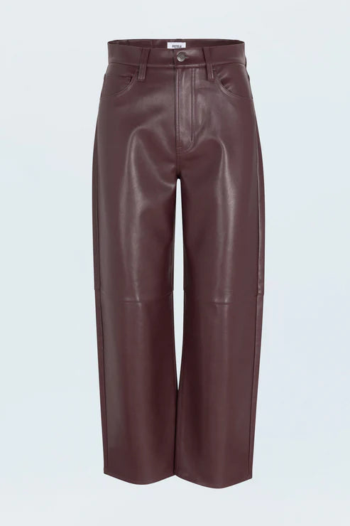 Brown leather pants on a light gray background product view