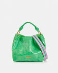 Green handbag with a pink strap on a white background