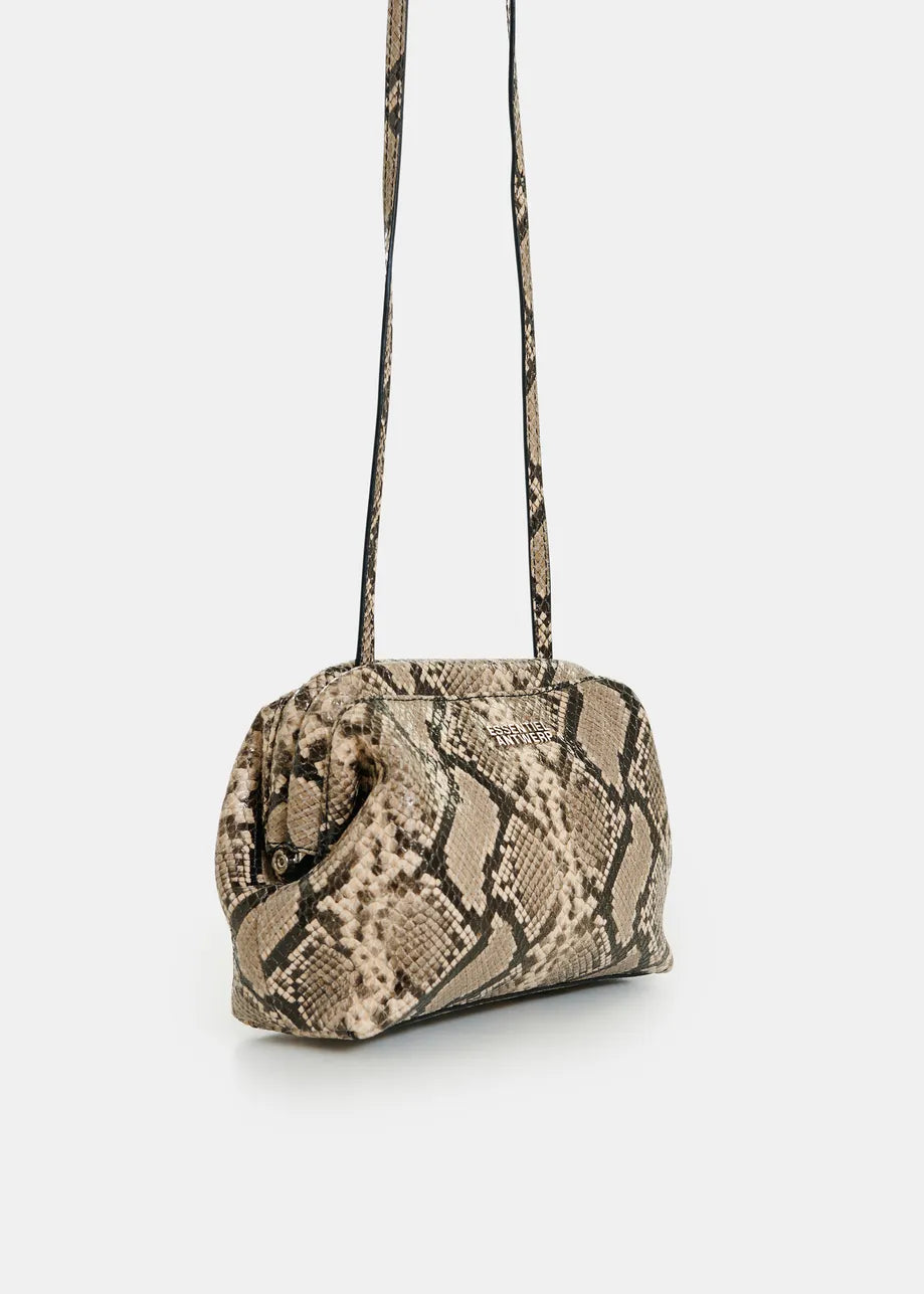 A snakeskin-patterned shoulder bag in beige, brown, and black, featuring a long thin strap, shown against a plain light gray background.