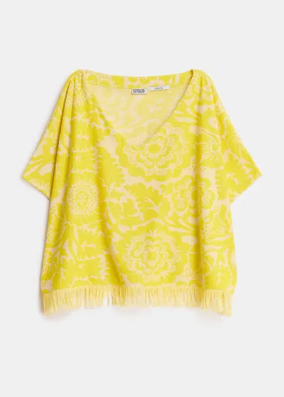 Yellow patterned top on a white background