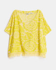 Yellow patterned top on a white background