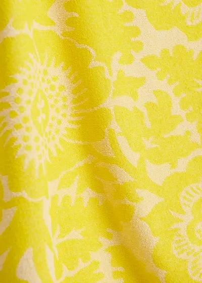 Close-up of yellow fabric with floral pattern