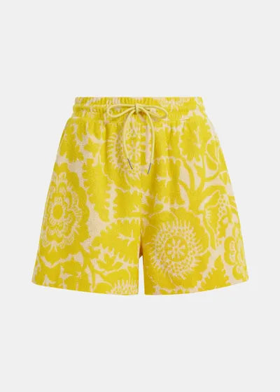 Yellow floral-patterned shorts on a white background