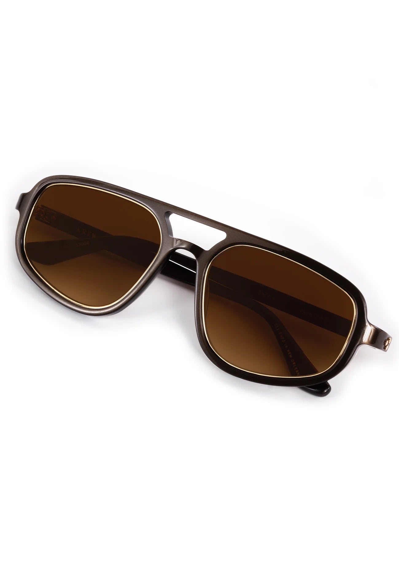 Aviator sunglasses with brown lenses on a white background