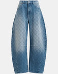 Blue jeans with a diamond pattern on a light gray background