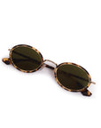 Round sunglasses with tortoiseshell frame and dark lenses on a white background