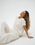 Ava Oversized Spandex Jersey Tee side view with model sitting on ground