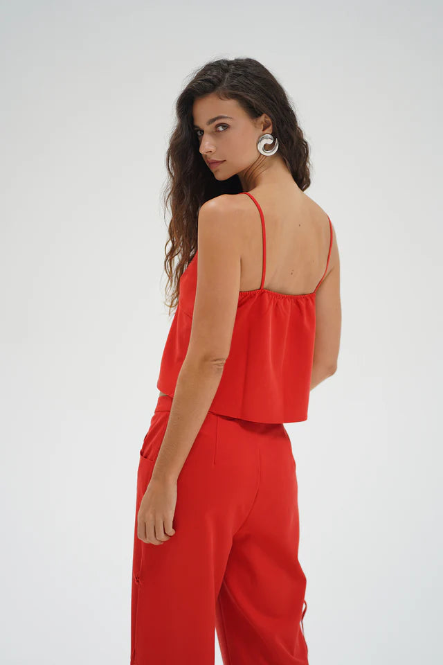 Woman wearing a red outfit on a white background