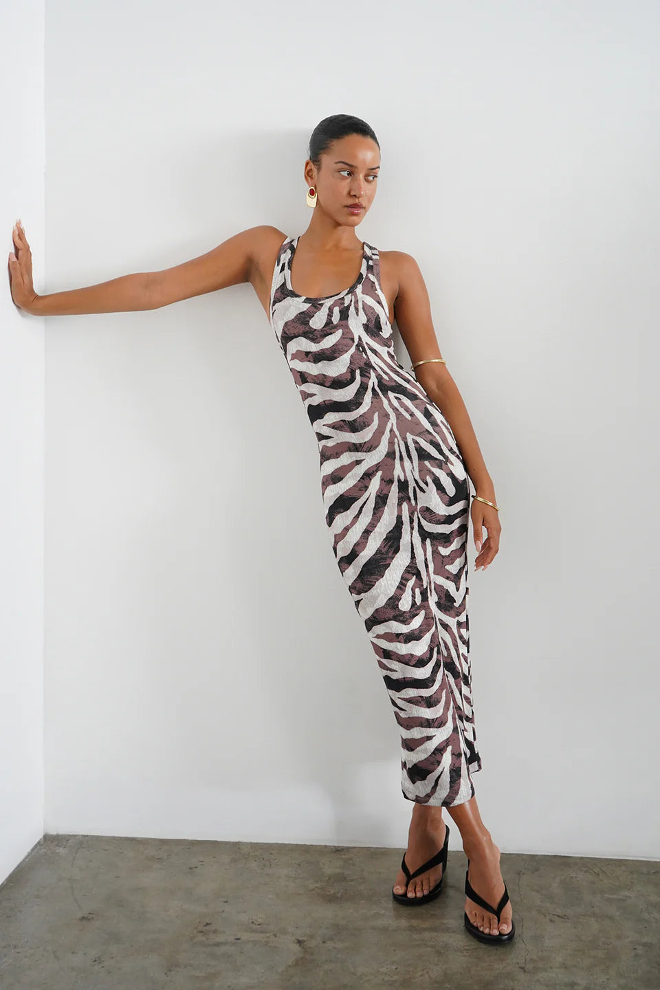 Safari Rib Timeless Tank Midi Dress model leaning against a wall