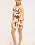 Woman wearing a floral dress on a white background