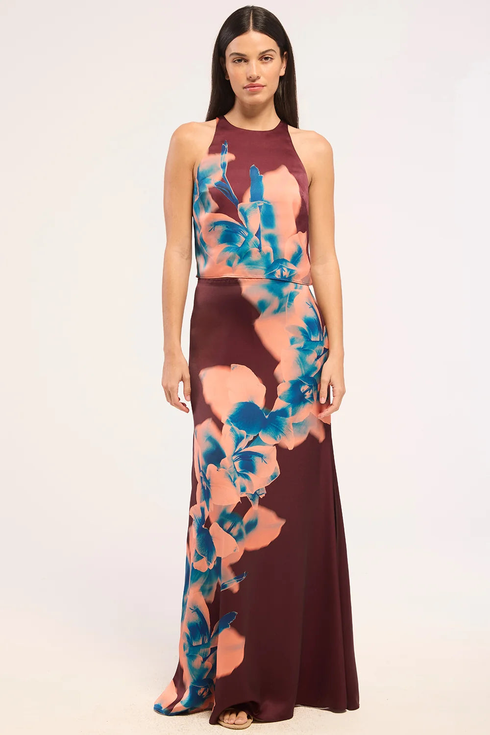 Woman wearing a floral dress with a white background