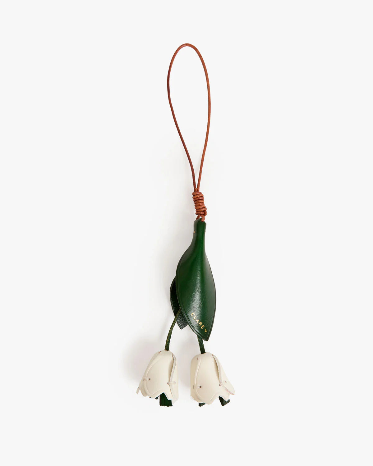 Decorative hanging plant with green leaf and white flowers on a white background