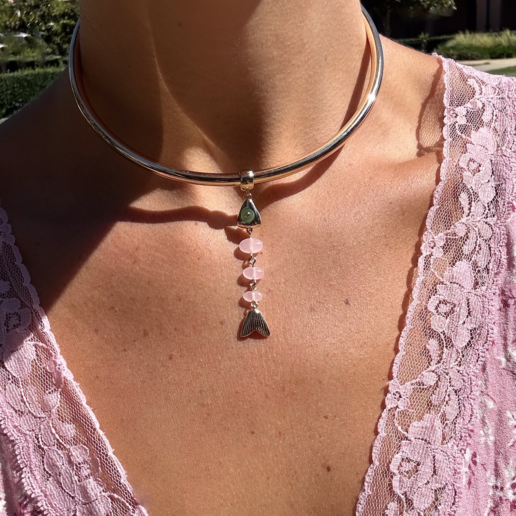 La Pez Jade Fish Bail Charm on gold-plated choker necklace on model