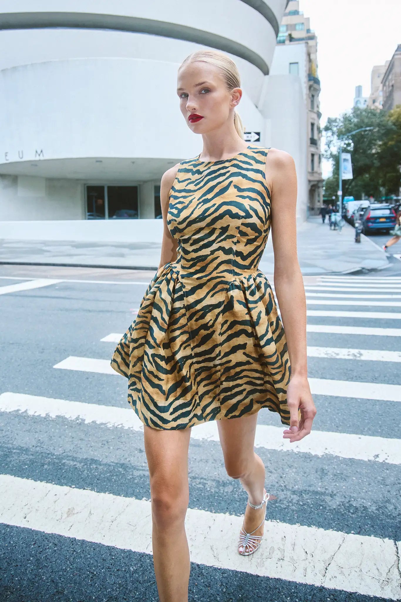 Layne Tiger Print Mini Dress on model walking across crosswalk