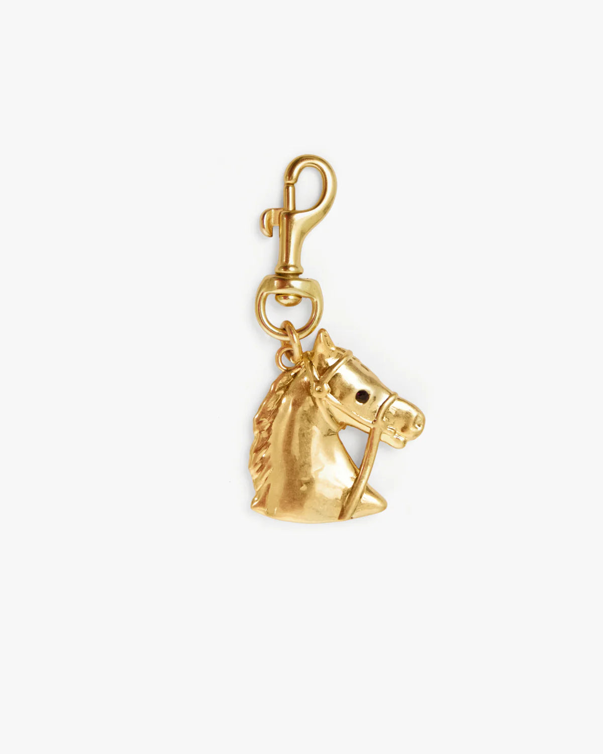 Gold horse head charm on a white background